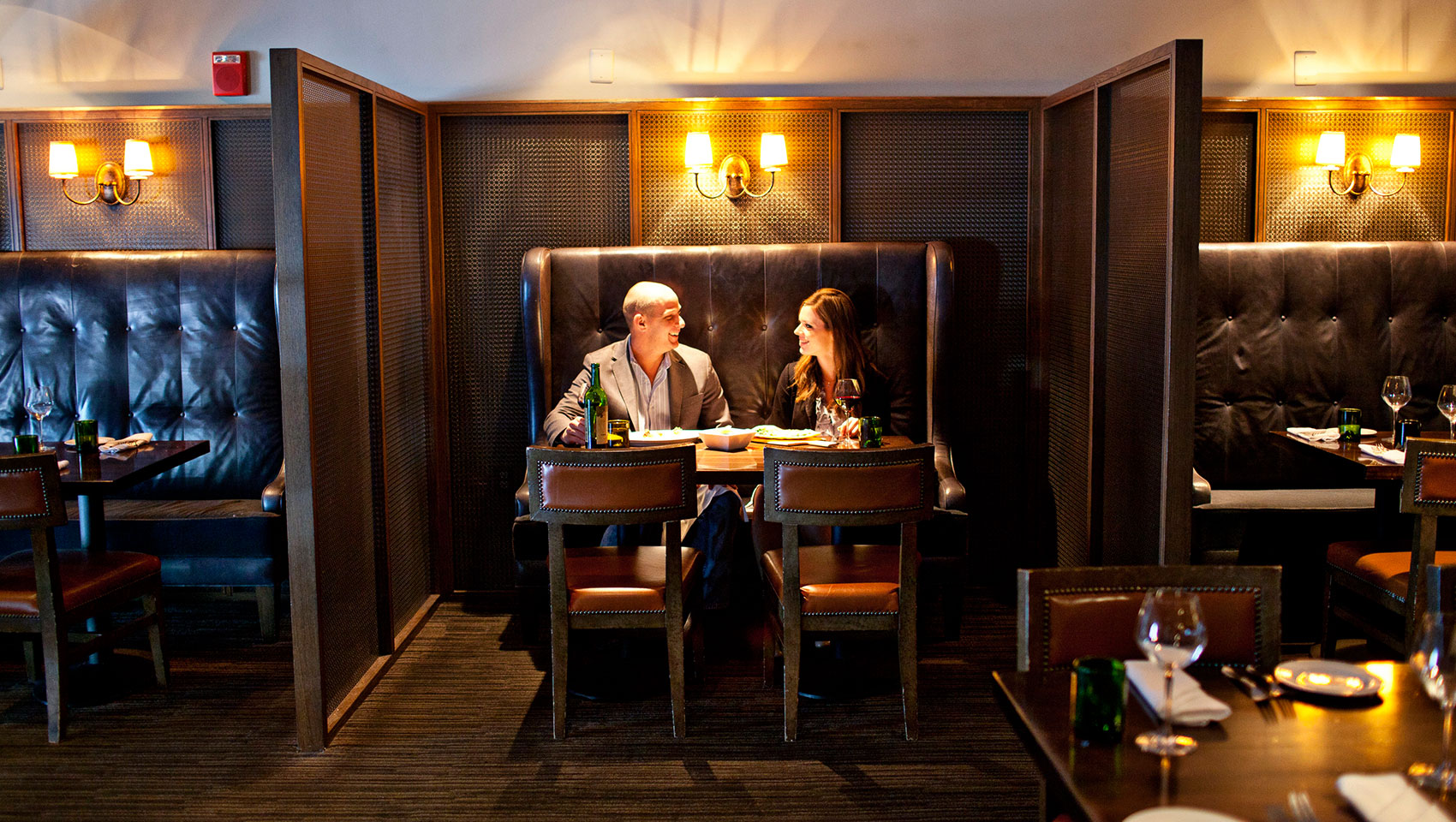 Couple sitting in a booth at B&O American Brasserie in Baltimore