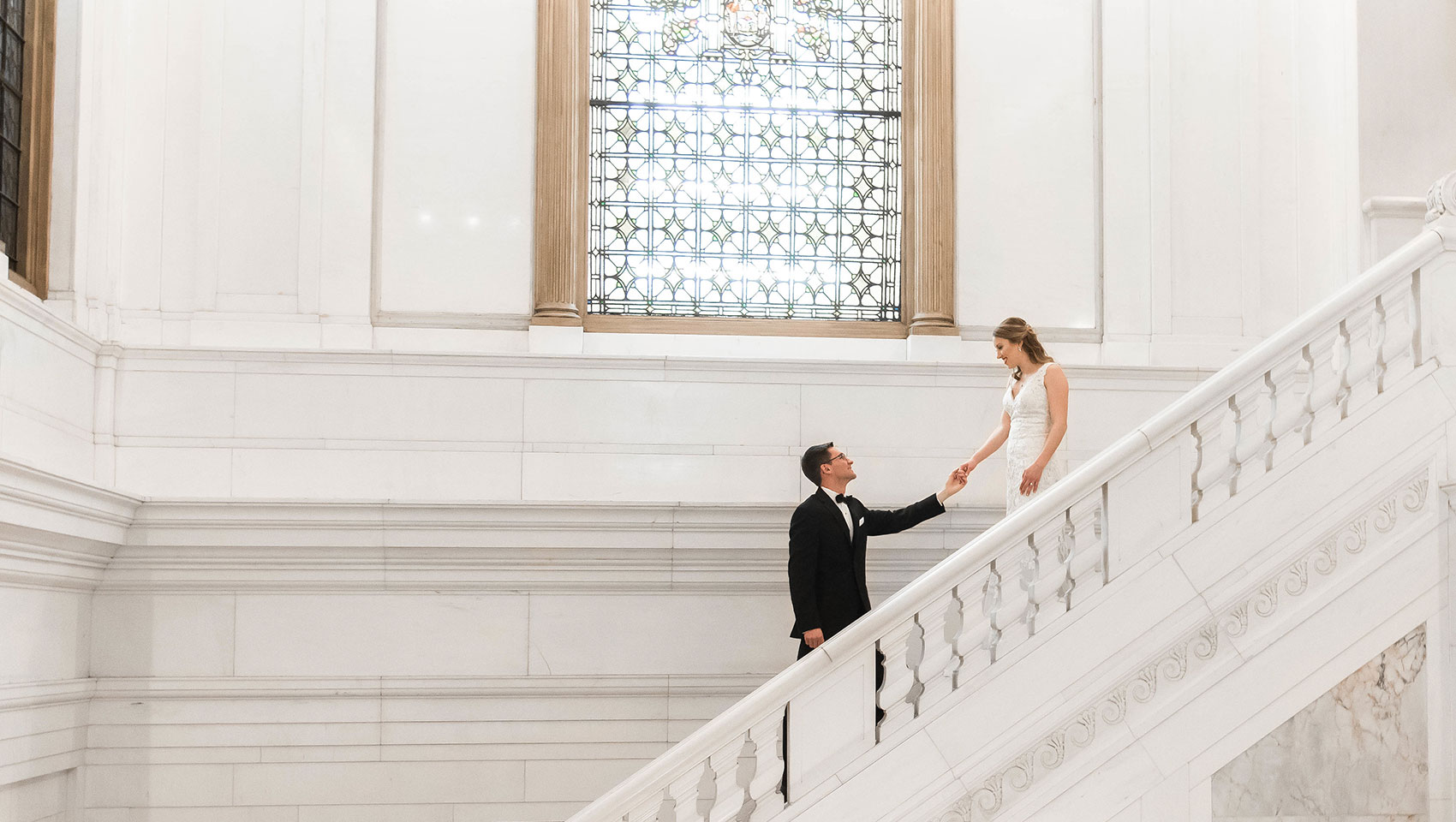 Holding hands on Staircase - JadeNikkolePhotography