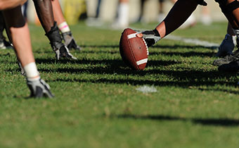 football players at the line of scrimmage